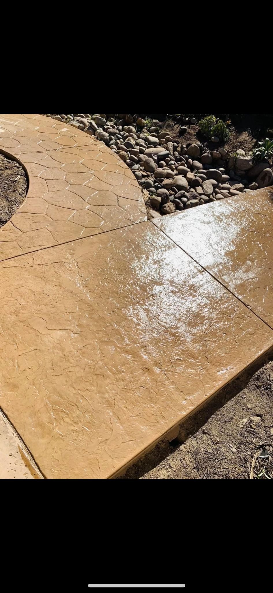 Stamped Concrete Patio with Rock Border